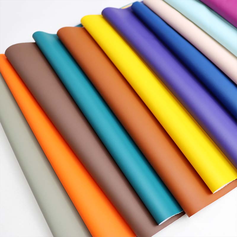 Zračen vodoodporen dežni plašč iz PU usnjene tkanine